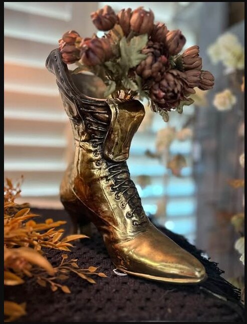 Vintage brass boot filled with dried florals at Rust & Grain