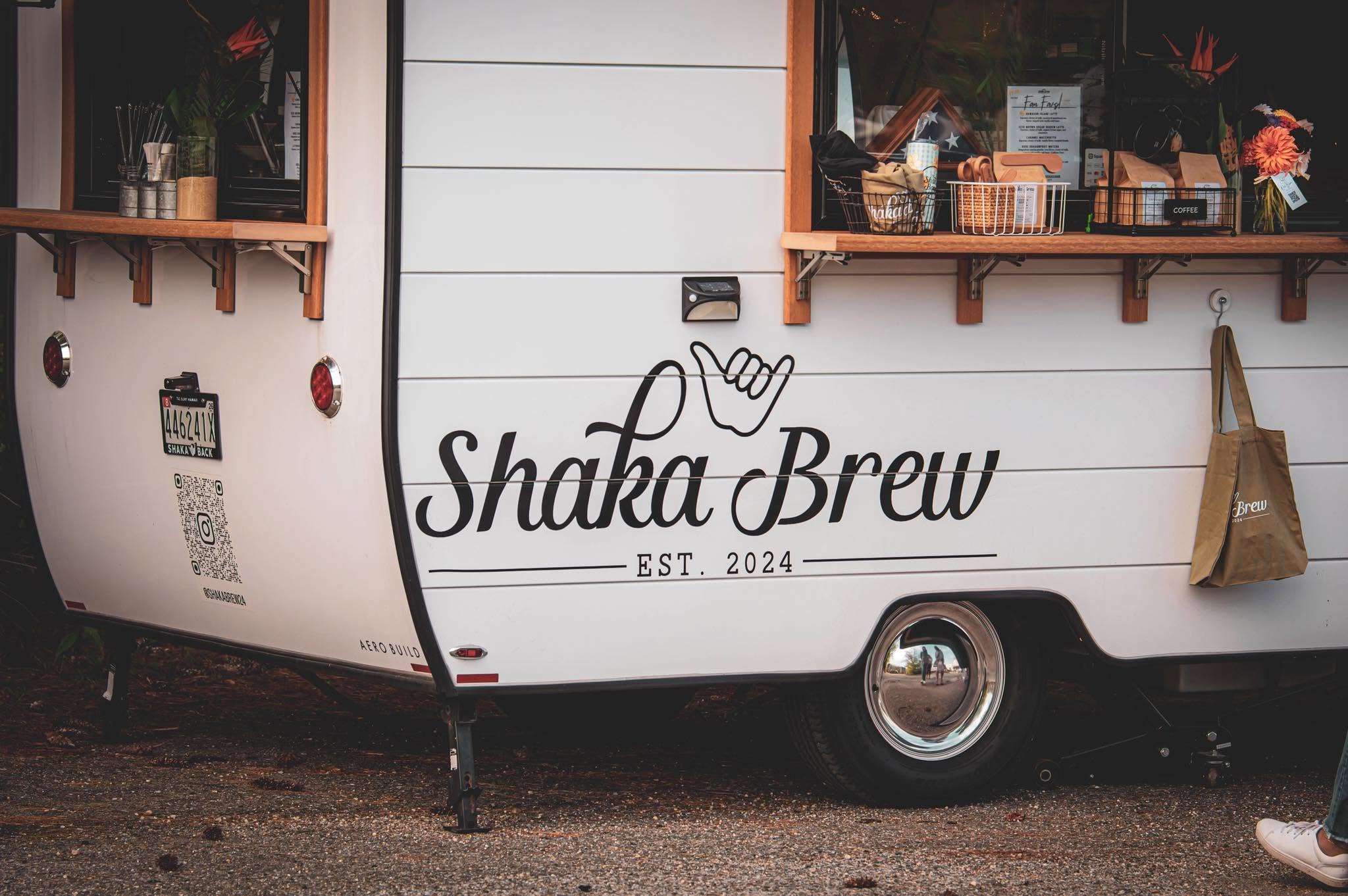 Shaka Brew mobile coffee trailer with its service windows open